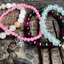 Load image into Gallery viewer, Stack of 4 natural crystal gemstone stacking bracelets with clover & lotus seed/flower charms