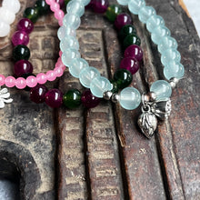 Load image into Gallery viewer, Stack of 4 natural crystal gemstone stacking bracelets with clover & lotus seed/flower charms