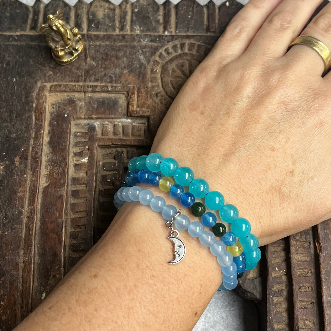 Trio of natural blue crystal gemstone stacking bracelets with moon charm